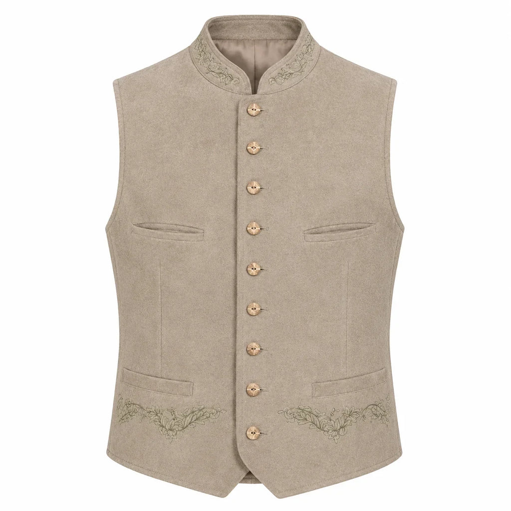 A light beige traditional German waistcoat (Mantel) with a mandarin collar, gold-tone buttons, and subtle green embroidery on the pockets and lower front, shown against a plain white background.