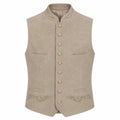 A light beige traditional German waistcoat (Mantel) with a mandarin collar, gold-tone buttons, and subtle green embroidery on the pockets and lower front, shown against a plain white background.
