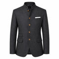 A dark gray textured wool-blend blazer with a mandarin collar, brown buttons, and a white pocket square, shown on a plain white background.