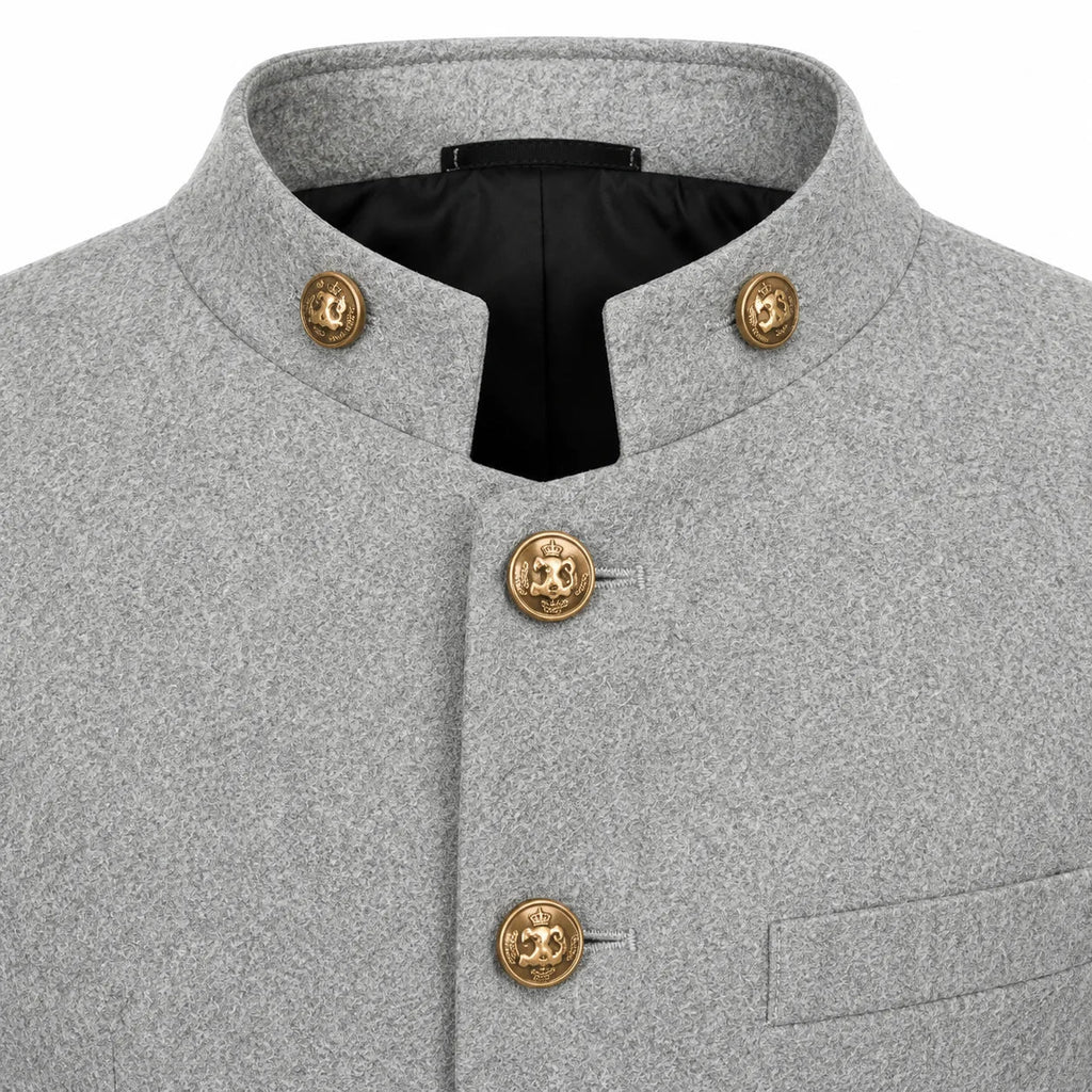 Close-up of a light gray textured jacket with a stand collar, black lining, and decorative gold-tone buttons on a white background.