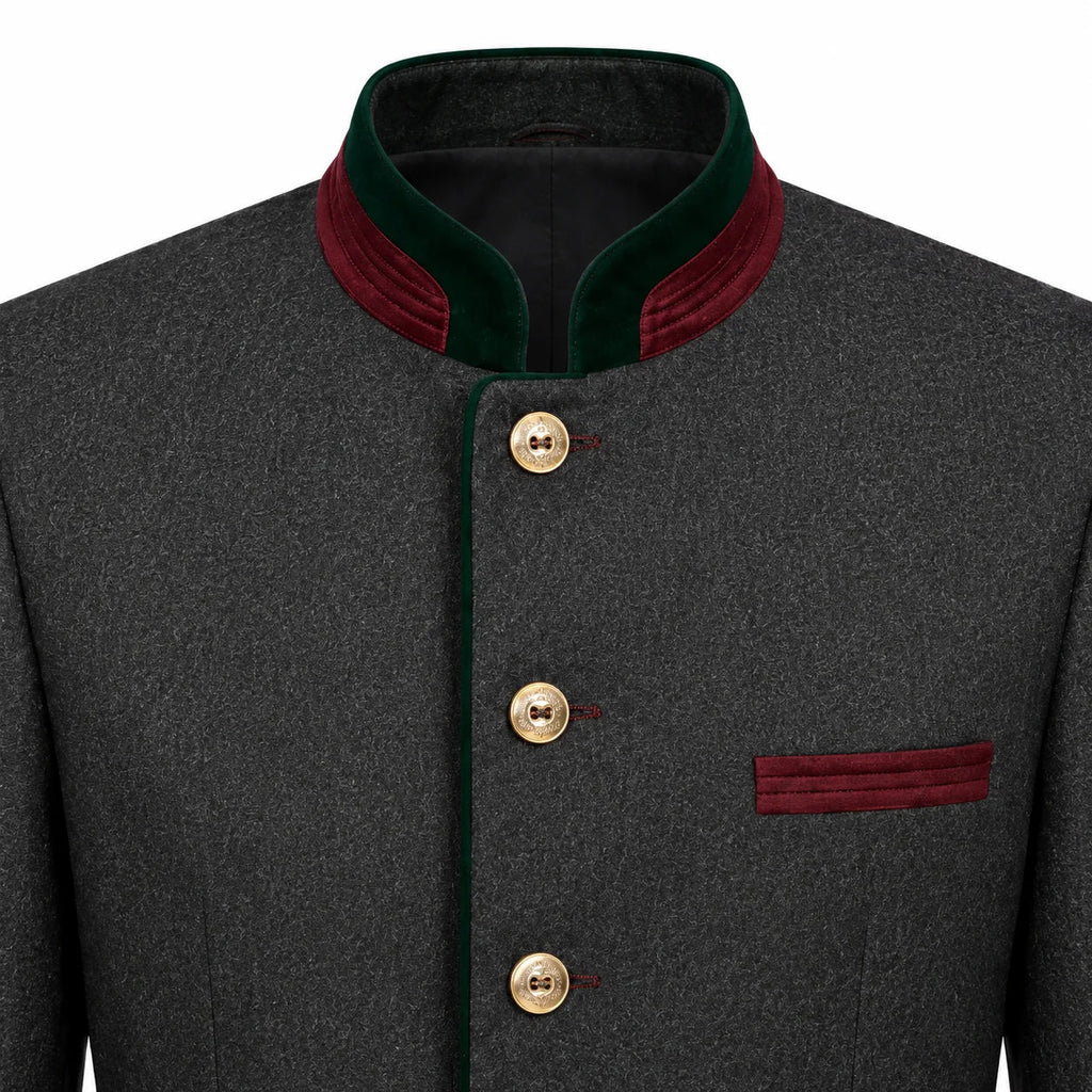 A close-up of a dark gray textured jacket with a mandarin collar, featuring dark green velvet trim, gold buttons, and a matching dark green pocket flap on a white background.