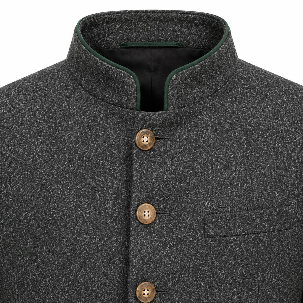 Close-up of a dark gray textured wool jacket with a mandarin collar, brown buttons, and a green piping accent on the collar.